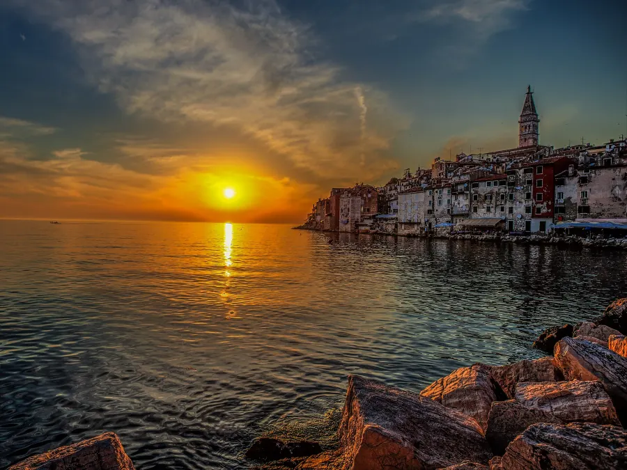 Sunset over the sea beside the old town of Rovinj in Istria